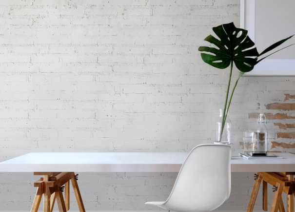 Minimal mockup desk and brick wall.